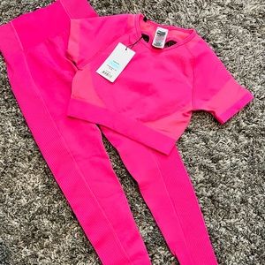 Brand new pop of pink Gymshark crop top and high waisted leggings.